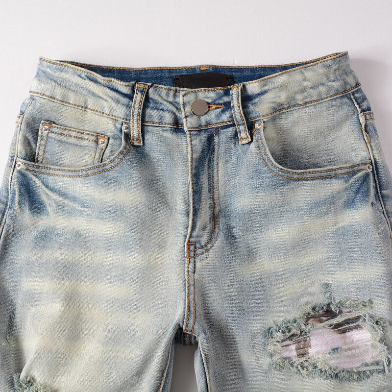 Distressed Faded Blue Ripped Jeans