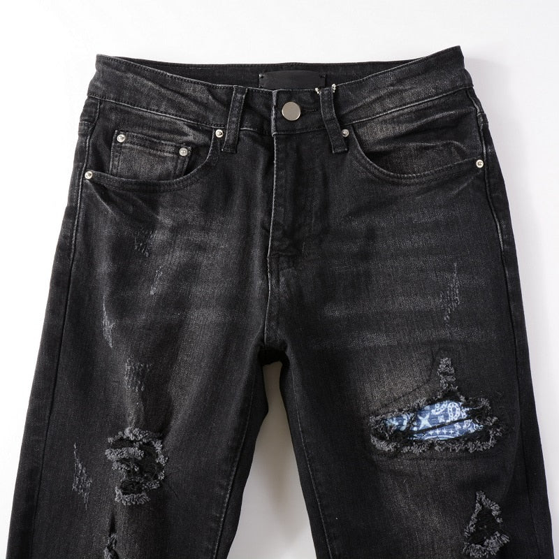 Men's Black Ripped Jeans: Slim fit, distressed, stretch denim with destroyed holes, tie-dye, bandana, ribs patches, and ripped details. Streetwear style.