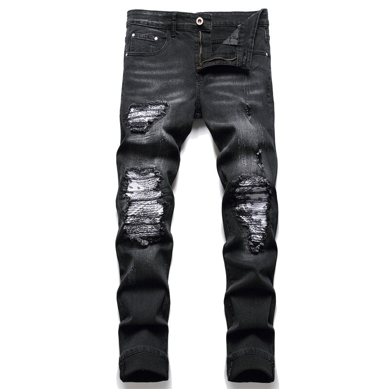 Cracked blue biker jeans: Pleated patch, ripped holes, distressed patchwork. Stretch denim, slim fit for streetwear style.