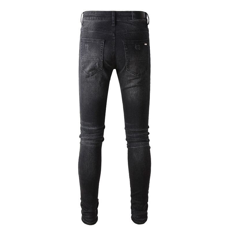 Men's Black Ripped Jeans: Slim fit, distressed, stretch denim with destroyed holes, tie-dye, bandana, ribs patches, and ripped details. Streetwear style.